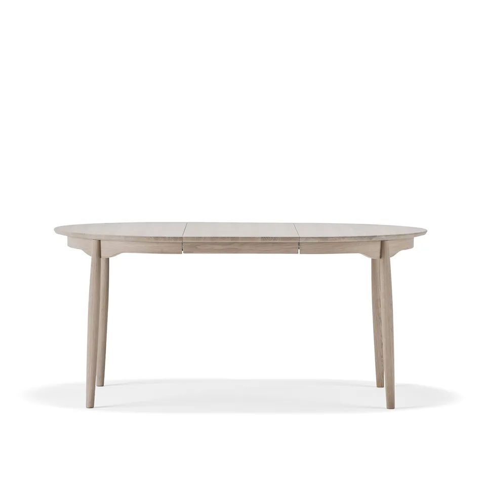 Carl spisebord Ø115 cm med ileggsplate